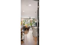 Open-concept living room with modern finishes, abundant natural light, and sleek hardwood flooring at 22 Airline Ne St # 201, Atlanta, GA 30312