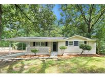 Charming single-story home featuring a front porch and carport at 1026 Eisenhower Se Ct, Atlanta, GA 30354