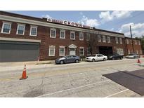 Exterior view of Candy Crown Food building with parking and a brick facade, featuring a vintage industrial design at 320 Martin Luther King Jr Dr # 5, Atlanta, GA 30312
