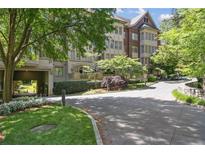 Beautiful brick building with a drive-through and well-manicured landscaping and mature trees at 1717 N Decatur Ne Rd # 322, Atlanta, GA 30307