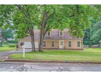 Charming one-story home featuring a manicured front yard and attached two car garage at 1739 Brandy Woods Se Trl, Conyers, GA 30013