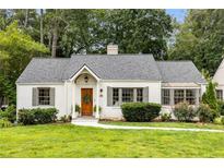 Charming, remodeled home features a landscaped lawn and updated walkway leading to the inviting front door at 711 Greenview Ne Ave, Atlanta, GA 30305