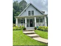 Charming craftsman-style home with welcoming front porch and well-manicured landscaping at 158 Delano Dr, Decatur, GA 30032
