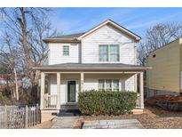 Charming two-story home with a welcoming front porch and well-maintained landscaping at 55 Bowen Ave, Atlanta, GA 30315
