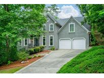 Charming two-story traditional home with landscaped front yard and a two-car garage at 265 Landfall Rd, Atlanta, GA 30328