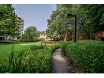 Beautifully landscaped grounds with manicured bushes and walking path at 1800 Clairmont Lk # A226, Decatur, GA 30033