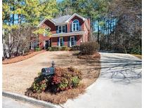 Charming brick two-story home with well-maintained landscaping and inviting curb appeal at , Lilburn, GA 30047