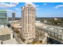 Exterior shot of the condominium building against a backdrop of the city at 3475 Oak Valley Ne Rd # 1930, Atlanta, GA 30326