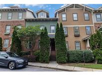 Charming townhomes featuring diverse exteriors and lush landscaping enhance curb appeal at 2114 Gorman Se Grv, Atlanta, GA 30316
