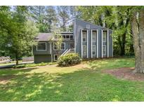 Charming two-story home with well-maintained lawn and mature trees in a serene and established neighborhood at 3962 Fairington Dr, Marietta, GA 30066