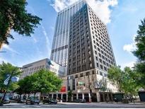 View of office building with trees in front on a sunny day at 20 Marietta Nw St # 13C, Atlanta, GA 30303