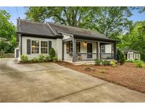 Charming bungalow with a welcoming front porch and well-maintained landscaping at 2201 Plantation Ln, Atlanta, GA 30341