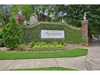 Landscaped entrance to 350 McGill Place with a vine-covered wall and decorative signage at 514 Mcgill Ne Pl, Atlanta, GA 30312