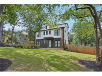 Modern two-story home features a combination of light and dark exterior paint and well-manicured lawn at 3087 Alston Dr, Decatur, GA 30032