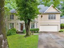 Charming two-story home with a manicured lawn and inviting curb appeal at 1488 Lachona Ne Ct, Atlanta, GA 30329