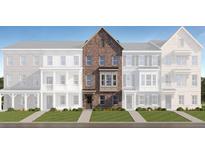 Exterior elevation of a brown brick townhouse with a well-manicured lawn at 813 Atkins Ln, Woodstock, GA 30188