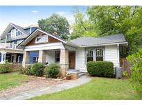 Charming home with stone pillar porch, tidy landscaping, and welcoming walkway at 2056 Hosea L Williams Ne Dr, Atlanta, GA 30317