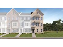 Charming townhome featuring light brick exterior, well-manicured lawn and three stories of comfortable living at 809 Atkins Ln, Woodstock, GA 30188