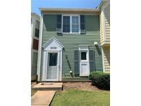 Charming home with a well-kept lawn and tidy shrubbery enhancing curb appeal at 6658 Ramsgate Way, Norcross, GA 30093