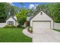 Charming single-story home featuring a well-maintained lawn, brick accents, and a two-car garage at 2277 Lazy Days Rd, Dacula, GA 30019
