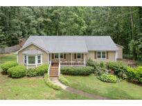 Charming single-story home with a well-maintained front yard and inviting porch at 1904 Britt Dr, Snellville, GA 30078