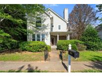 Charming two-story home with landscaped front yard and inviting entrance at 1995 Liberty Hts, Fairburn, GA 30213