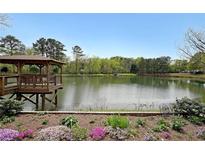 Scenic water view featuring a gazebo and landscaping, creating a serene outdoor living space at 1800 Clairmont Lk # 630, Decatur, GA 30033