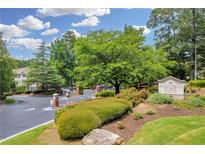 The community entrance welcomes you with lush landscaping and signage to Parkwood Place Condominiums at 1250 Parkwood Se Cir # 1213, Atlanta, GA 30339