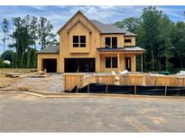 Exterior view of home under construction showing the framing and some roof work at 723 Crest Line Trl, Powder Springs, GA 30127