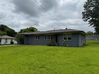 Charming single-story home featuring a well-maintained lawn and mature trees at 3551 Clay Rd, Austell, GA 30106