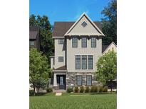 New construction home featuring stone accents, gray siding, a gable roof, and professional landscaping at 2210 Park Walke Dr, Alpharetta, GA 30009
