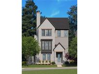 Charming two-story home with elegant brickwork, complemented by lush landscaping, offering a welcoming curb appeal at 2285 Park Walke Dr, Alpharetta, GA 30009