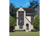 New construction home featuring a brick facade, dark trim windows, and modern architectural details at 2275 Park Walke Dr, Alpharetta, GA 30009