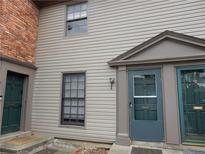 Two-story townhouse featuring a well-maintained exterior and inviting front door at 3083 Colonial Way # E, Atlanta, GA 30341