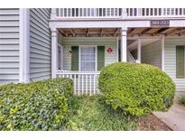 Charming condo with a covered porch and well-maintained landscaping at 301 Cobblestone Trl, Avondale Estates, GA 30002
