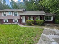 Charming two-story home with a well-maintained lawn, brick accents, and inviting front entrance at 2670 Foxlair Trl, South Fulton, GA 30349