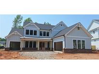 Charming new two-story home featuring board and batten siding, double garage, and a welcoming front porch at 4605 Aiden Way, Cumming, GA 30041