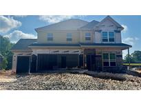 Unfinished two-story home with a three-car garage, and lots of potential at 5390 Julep Ct, Cumming, GA 30028
