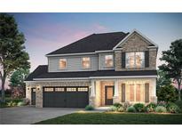 Charming two-story home featuring a two-car garage, stone accents, and inviting front porch at 5390 Julep Ct, Cumming, GA 30028