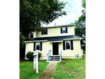 Charming two-story home with a manicured lawn and inviting front entrance at 210 Ormond Sw St, Atlanta, GA 30315
