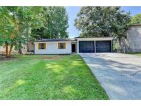 Charming single-story home featuring a well-manicured lawn and an attached two-car garage at 2508 Wagon Trce, Duluth, GA 30096