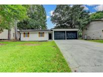 Charming single-story home with a well-maintained lawn and a two-car garage at 2508 Wagon Trce, Duluth, GA 30096