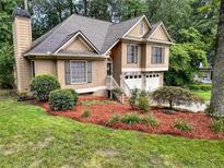 Charming two-story home with landscaped yard and two-car garage at 4801 Deer Chase, Powder Springs, GA 30127