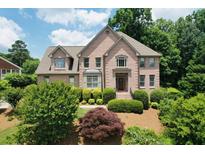 Charming two-story brick home with mature landscaping and inviting front entrance at 2640 Preston Ridge Ln, Dacula, GA 30019