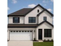 Charming two-story home with a white brick exterior, dark roof, black trim, and a spacious two-car garage at 2913 Sunrise Ridge Rd, Snellville, GA 30078