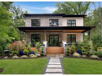 Charming two-story home with landscaped yard, stone accents, and inviting front porch at 1380 Wayne Ne Ave, Atlanta, GA 30306