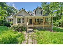 Charming home featuring a front porch, well-maintained lawn, and inviting curb appeal at 2958 Paul Harris Rd, Dallas, GA 30157