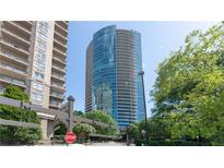 Modern high-rise apartment building with reflective glass and private balconies at 3338 Peachtree Ne Rd # 1506, Atlanta, GA 30326