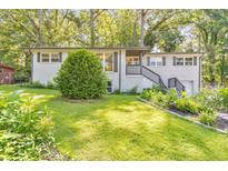 Charming home with a beautifully landscaped yard and fresh exterior paint at 2254 Glendale Dr, Decatur, GA 30032