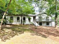 Charming, bright, one-story home with a deck and beautiful landscaping at 5384 Blackhawk Dr, Acworth, GA 30102